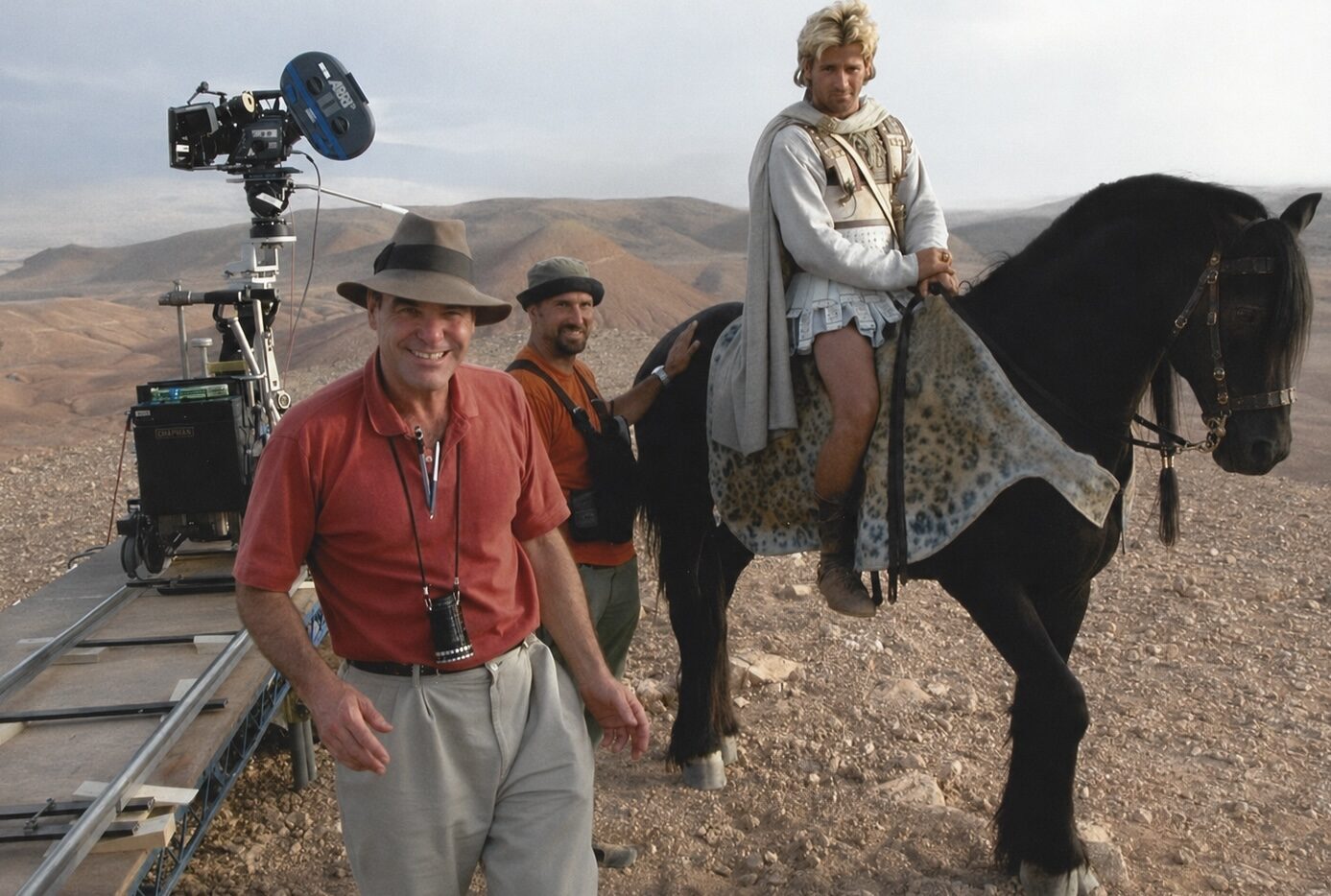 Peter Pedrero beside the camera during a horseback action production