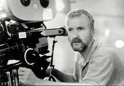 James Cameron beside a film camera