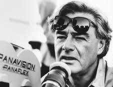 Richard Donner beside a film camera