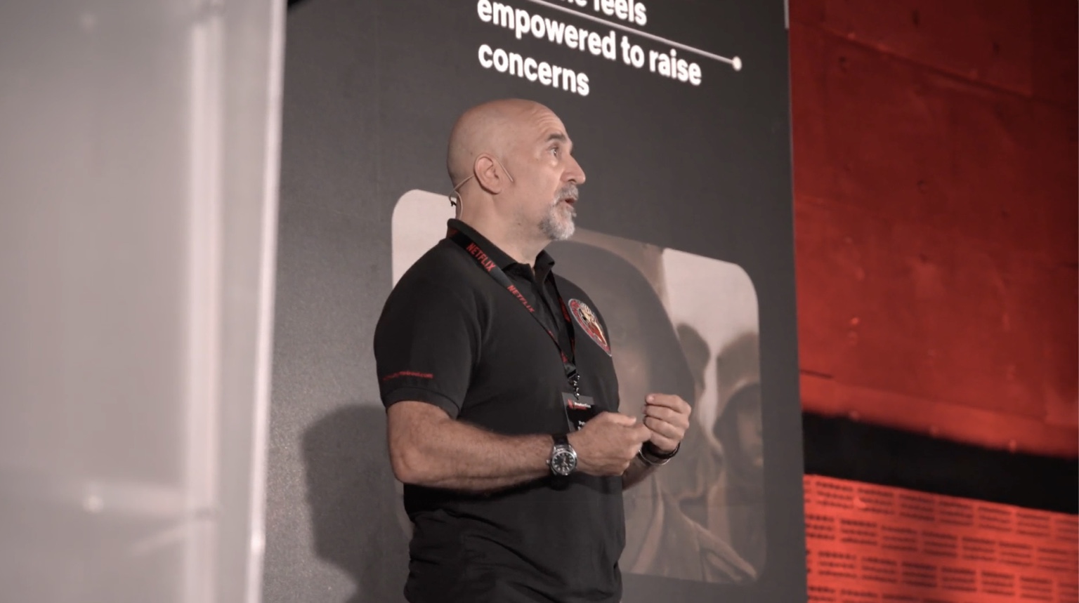 Peter Pedrero presenting on stage at the Netflix Production Summit